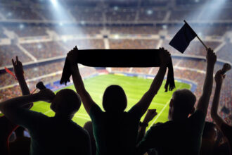 People attending a sports event at a stadium